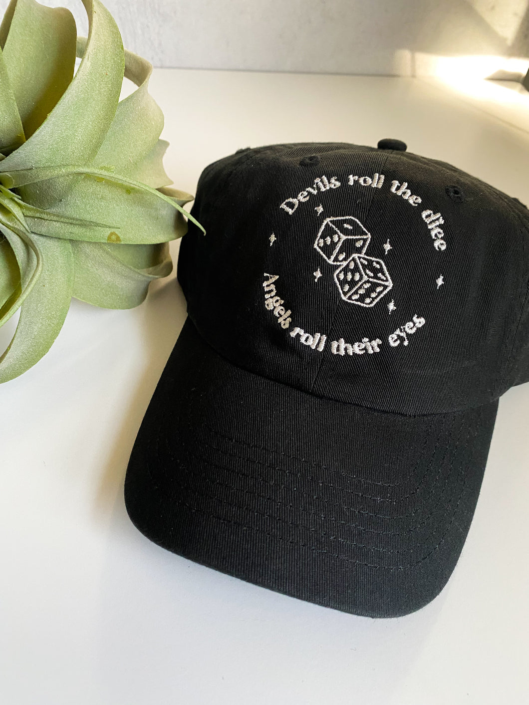 Devils roll the dice, Angel roll their eyes Relaxed Fit Hat